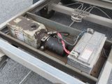 an image of a trailer with a motor and a battery in it