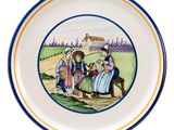 an image of a plate with a picture of people on it