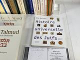 many books that are on a table next to each other