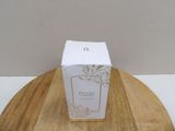 a white box sitting on top of a wooden table
