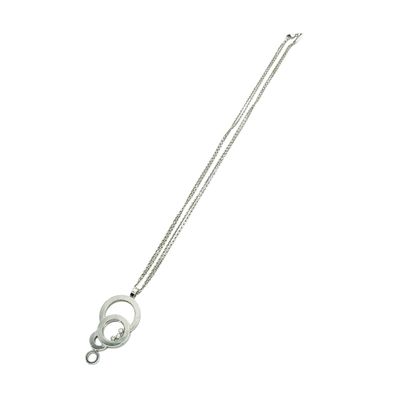silver plated necklace with a circular pendant and a silver chain