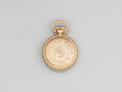 an old gold pocket watch with a chain hanging from it ' s side
