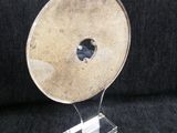 a metal object with a hole in the middle of it