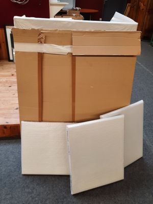 boxes stacked on top of each other on the floor in a room