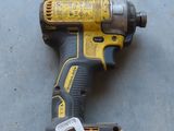 a cordless drill that is laying on the floor