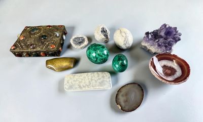 several different types of rocks and stones on a white surface