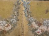 a painting of flowers painted on the wall of a room
