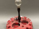 an image of a red object with a glass ball on it