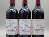 trois bouteilles de vin rouge posées côte à côte sur une table