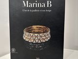 the book is sitting on a white table with a black background