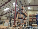 a large warehouse filled with lots of shelves and pallets