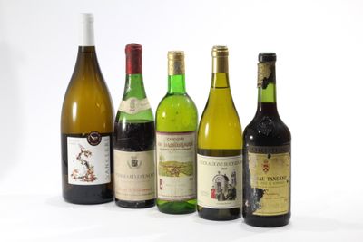 several bottles of wine are lined up in a row on a white surface