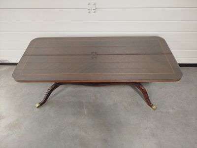 an image of a coffee table with a wooden top in a garage