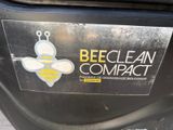 a sticker that says bee clean compact on the side of a car