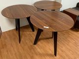 three tables that are sitting on a hard wood floor