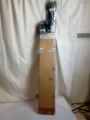 a statue of a cat sitting on top of a cardboard box
