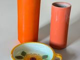 two vases that are sitting next to each other