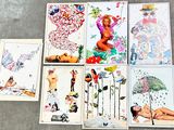 many cards with pictures of women on them on the floor