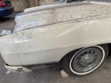 a white car that is parked in a garage