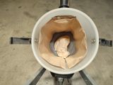 a picture of a toilet with a paper bag in it