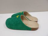 pair of green sued slippers with yellow stars on them