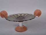 a glass bowl on a wooden stand on a white background
