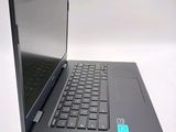 a black laptop with a blue sticker on the screen