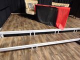 a stage set up with a red and black curtain