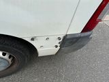 a white van parked on the side of the road