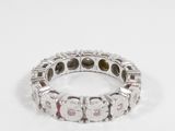 an image of a diamond and white gold ring on a white surface