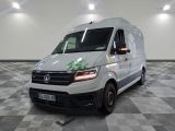 the white van is parked on a checkered floor in a room