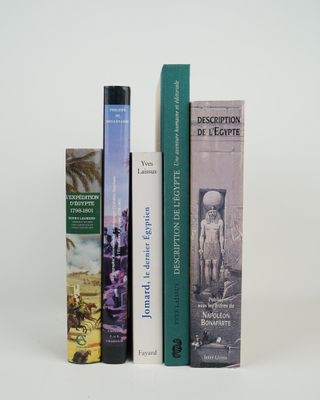 three books that are sitting next to each other on a table