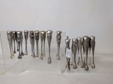 a lot of silver spoons that are on display
