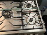 a silver stove top with two burners on it