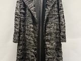 a black and white coat hanging on a hanger