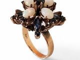 an image of a gold ring with oplites and sapphires