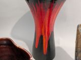 three different types of vases sitting on a table