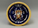 assiette bleue et dorée ornée d'une image de lion