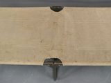 a cardboard box with a piece of wood sticking out of it