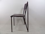 a chair that is leaning up against a wall