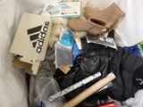 a pile of assorted items in a trash can