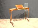 a wooden desk with a laptop on top of it