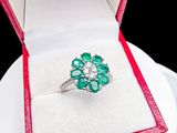 a ring that is sitting in a box on a plate
