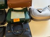 a lot of purses that are on a table