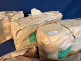bags of food sitting on a table with a blue background
