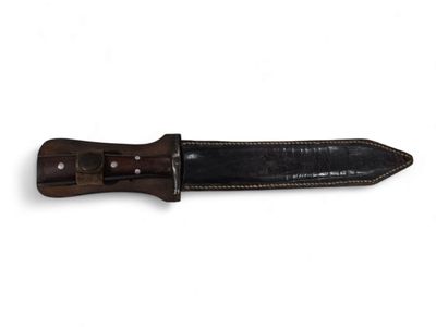 brown leather sheathed knife with black handle on a white background