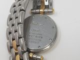 an image of a close up of a wrist watch on a white surface