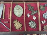 a wooden box with many different items in it