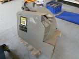 a machine that is sitting on a pallet in a garage