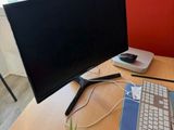 a desk with a keyboard, mouse, and monitor on it